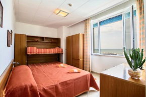 ISA-Family room with balcony and side sea view in hotel with swimming pool in Marina di Cecina, just 10 meters from the sea